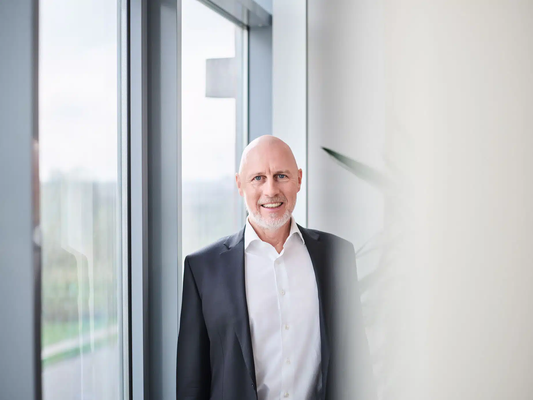 Businessman smiling in the office building.